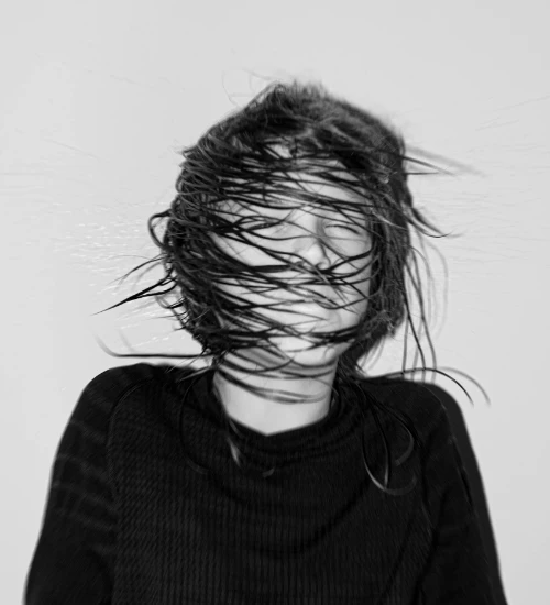 person dramatically shaking their head - photo by Kelemen Boldizsár