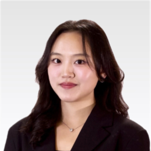 Professional headshot of Cece in a black blazer.